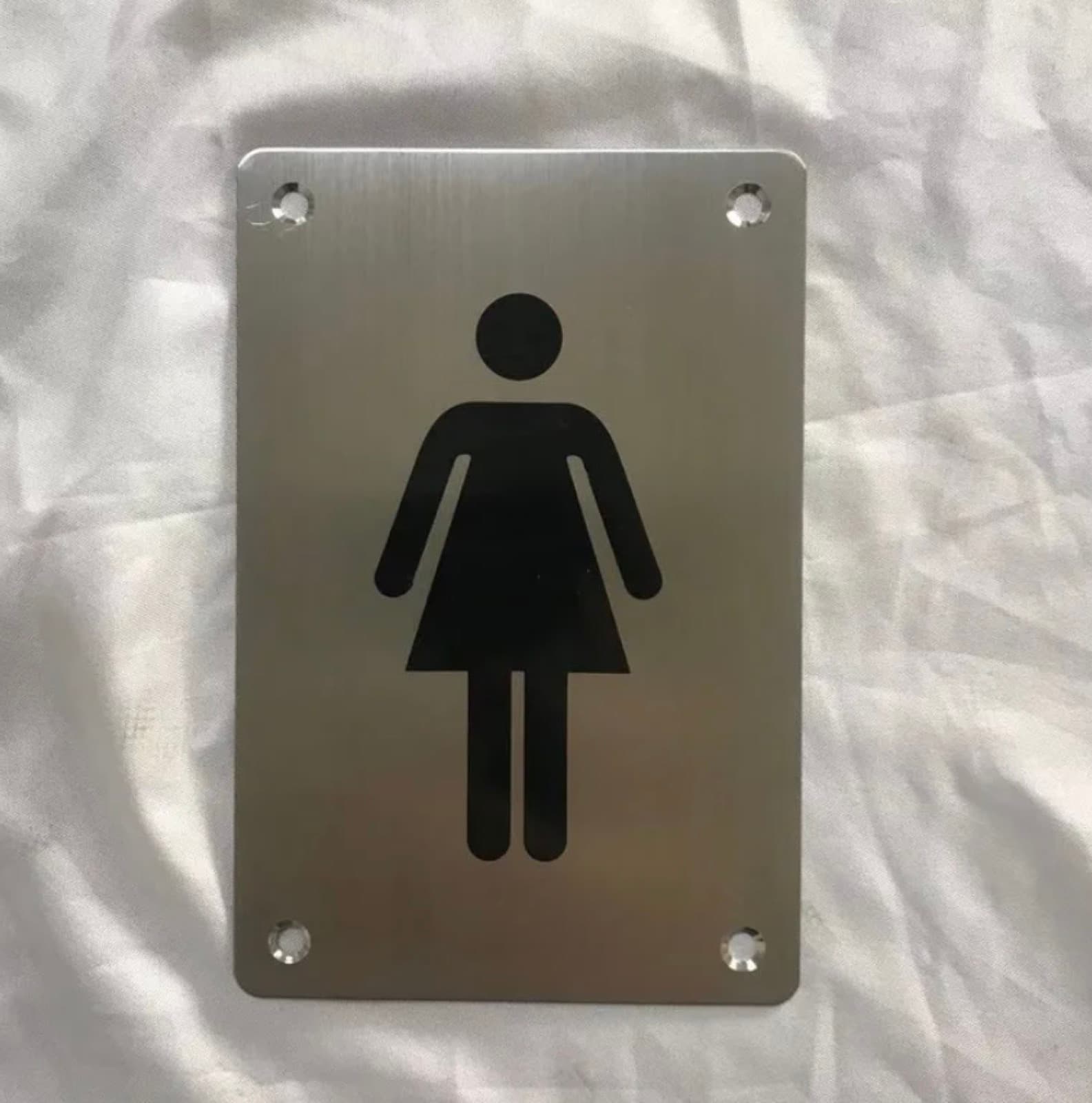 Señalética de acero inoxidable grabada para baños